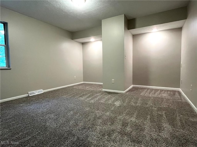 8602 Wedgewood Ave NW, North Canton, OH 44720 - empty room featuring carpet floors and a textured ceiling