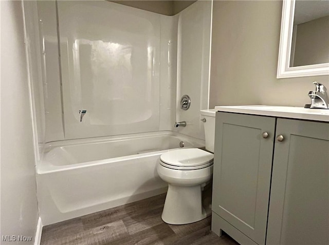 8602 Wedgewood Ave NW, North Canton, OH 44720 - full bathroom featuring wood finished floors, vanity, and tub / shower combination