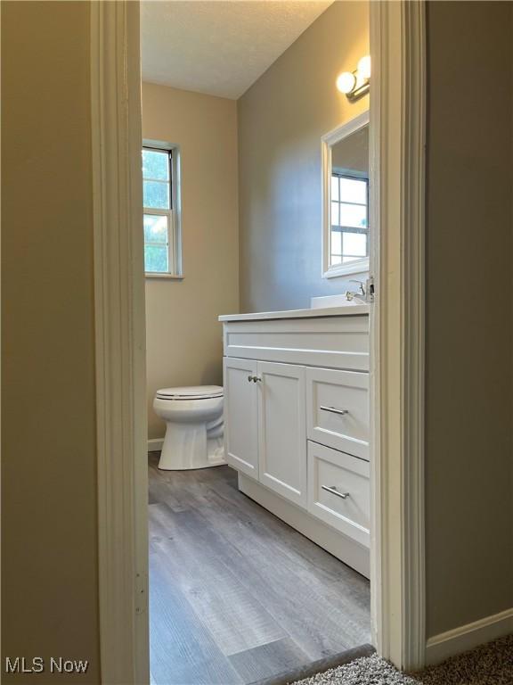 8602 Wedgewood Ave NW, North Canton, OH 44720 - bathroom with vanity and wood finished floors