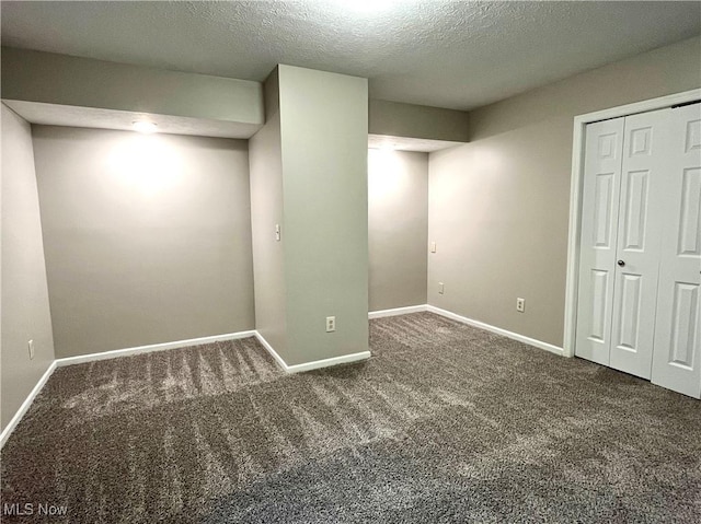 8602 Wedgewood Ave NW, North Canton, OH 44720 - below grade area featuring carpet flooring and a textured ceiling