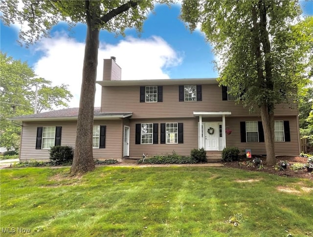 8602 Wedgewood Ave NW, North Canton, OH 44720 - view of front of house with a chimney and a front yard