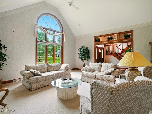 2526 Ashbrook Dr, Ashtabula, OH 44004 - living room featuring carpet flooring, wallpapered walls, a ceiling fan, high vaulted ceiling, and stairway