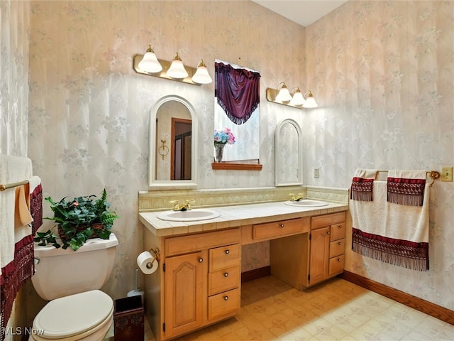 2526 Ashbrook Dr, Ashtabula, OH 44004 - bathroom featuring wallpapered walls, tile patterned floors, and double vanity