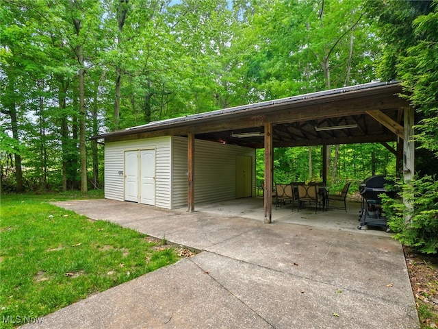 2526 Ashbrook Dr, Ashtabula, OH 44004 - view of parking / parking lot featuring a carport