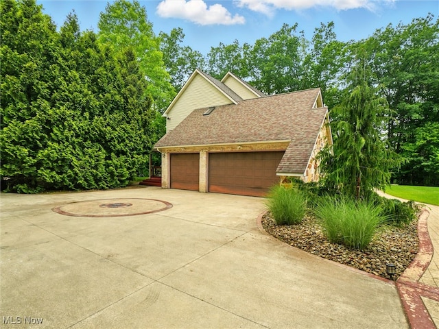 2526 Ashbrook Dr, Ashtabula, OH 44004 - garage featuring driveway
