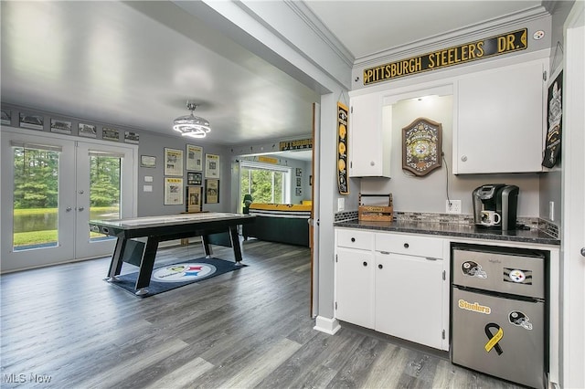 13645 Salem Church St NE, Paris, OH 44669 - kitchen with refrigerator, dark countertops, crown molding, white cabinets, and wood finished floors