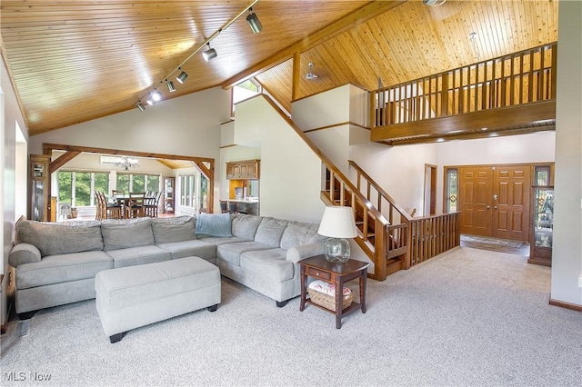 13645 Salem Church St NE, Paris, OH 44669 - living area with high vaulted ceiling, rail lighting, carpet flooring, stairs, and wood ceiling
