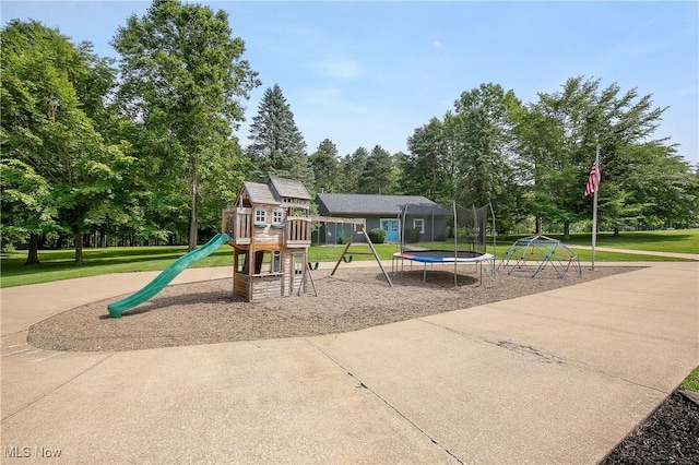 13645 Salem Church St NE, Paris, OH 44669 - community jungle gym with a lawn, a trampoline, and view of wooded area
