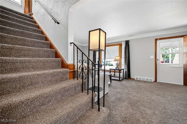 5077 Catherine St, Maple Heights, OH 44137 - staircase featuring carpet flooring