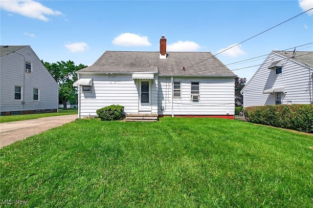 5077 Catherine St, Maple Heights, OH 44137 - rear view of house featuring a chimney, a lawn, roof with shingles, and cooling unit