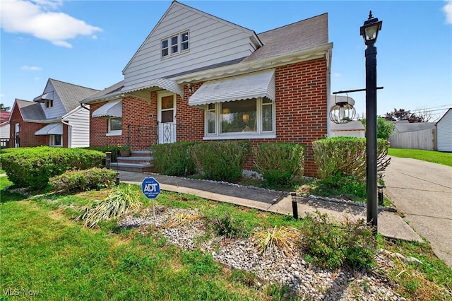5077 Catherine St, Maple Heights, OH 44137 - bungalow-style home with brick siding
