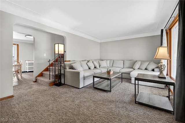 5077 Catherine St, Maple Heights, OH 44137 - living room featuring arched walkways, carpet floors, and stairway