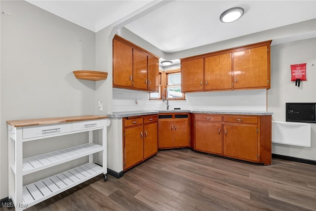 5077 Catherine St, Maple Heights, OH 44137 - kitchen with dark wood-style flooring, brown cabinets, and light countertops