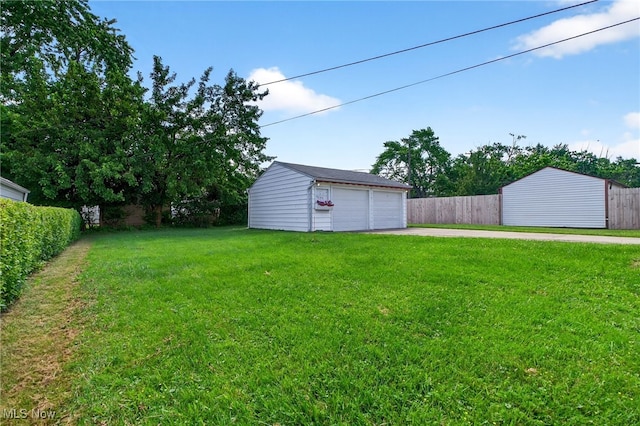 5077 Catherine St, Maple Heights, OH 44137 - view of yard featuring a garage and an outbuilding
