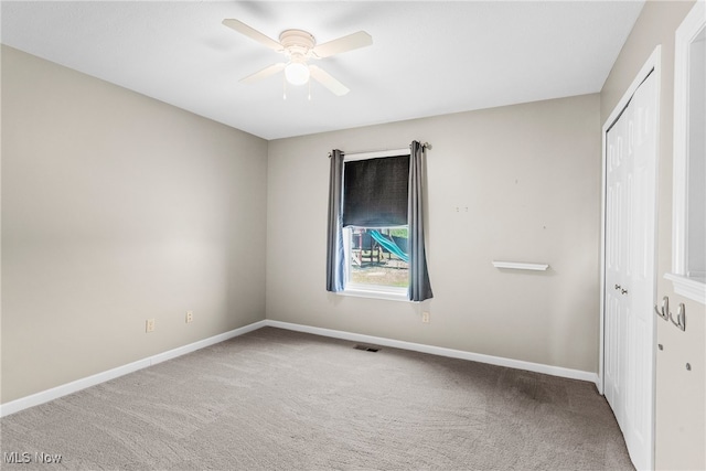 5215 River Rd, Madison, OH 44057 - unfurnished bedroom with carpet floors, a closet, and ceiling fan