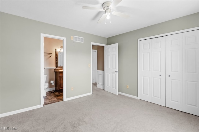 5215 River Rd, Madison, OH 44057 - unfurnished bedroom with carpet flooring, a closet, ceiling fan, and ensuite bath