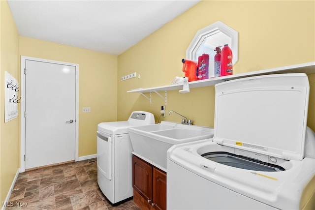 5215 River Rd, Madison, OH 44057 - laundry room with cabinet space and stone finish floors