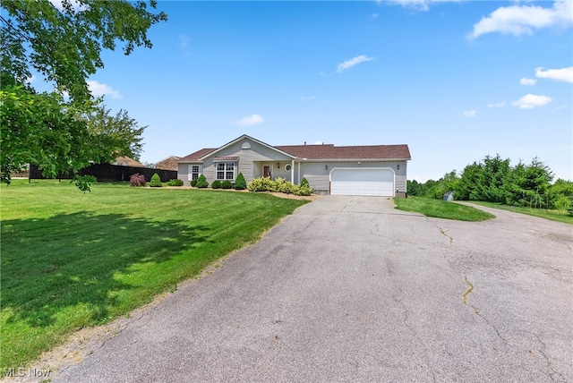 5215 River Rd, Madison, OH 44057 - ranch-style home featuring an attached garage and driveway