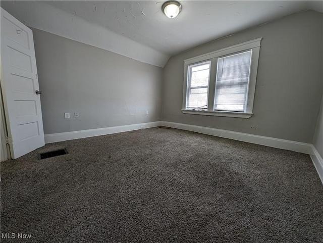 1268 E 169th St, Cleveland, OH 44110 - empty room featuring vaulted ceiling and carpet