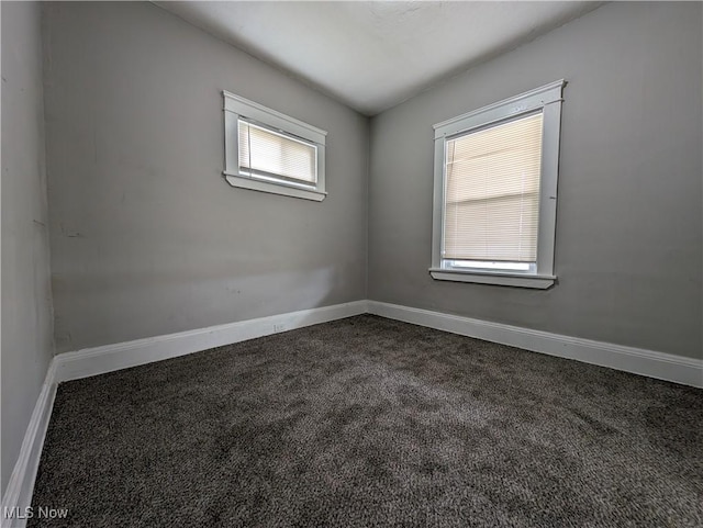 1268 E 169th St, Cleveland, OH 44110 - unfurnished room featuring dark colored carpet and baseboards