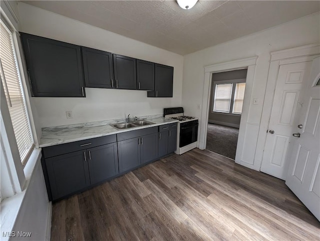 1268 E 169th St, Cleveland, OH 44110 - kitchen featuring white range with gas cooktop and dark wood-style flooring