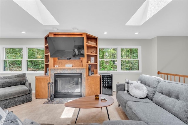 820 Old Spring Rd, Copley, OH 44321 - living area with a skylight, plenty of natural light, a tiled fireplace, and recessed lighting