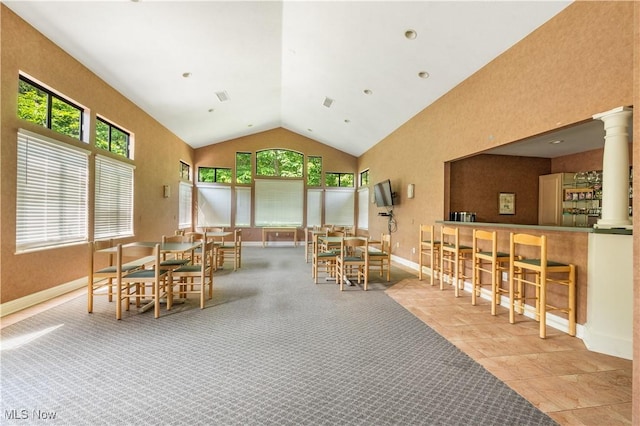 3800 Rosemont Blvd Unit 114C, Akron, OH 44333 - dining space with plenty of natural light, high vaulted ceiling, and decorative columns