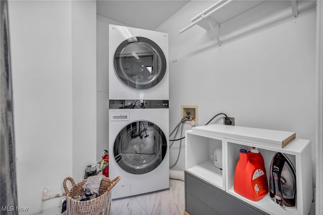 3800 Rosemont Blvd Unit 114C, Akron, OH 44333 - laundry room with stacked washer / dryer and light marble finish flooring