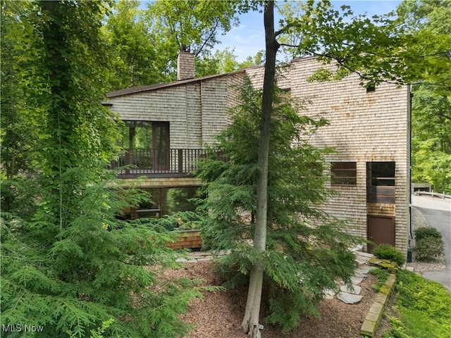 4 Valley Rdg, Farm, Hunting Valley, OH 44022 - view of home's exterior featuring a chimney and a deck