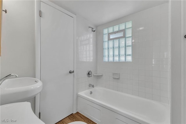 259 Marion Dr, Bedford, OH 44146 - bathroom with bathtub / shower combination and wood finished floors