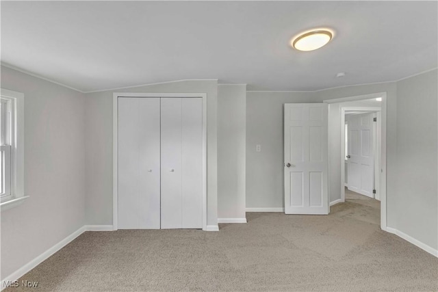 259 Marion Dr, Bedford, OH 44146 - unfurnished bedroom with carpet floors, a closet, and crown molding