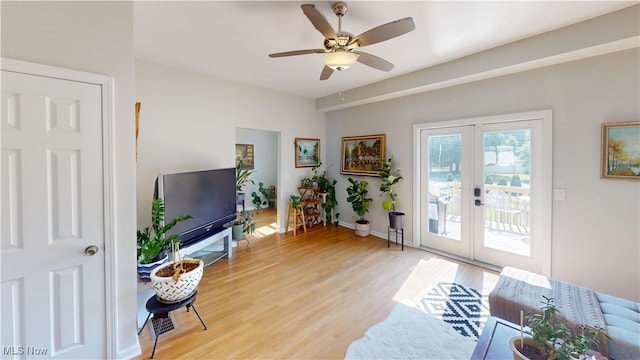 409 W Grant St, Kent, OH 44240 - living area featuring french doors, light wood finished floors, and a ceiling fan