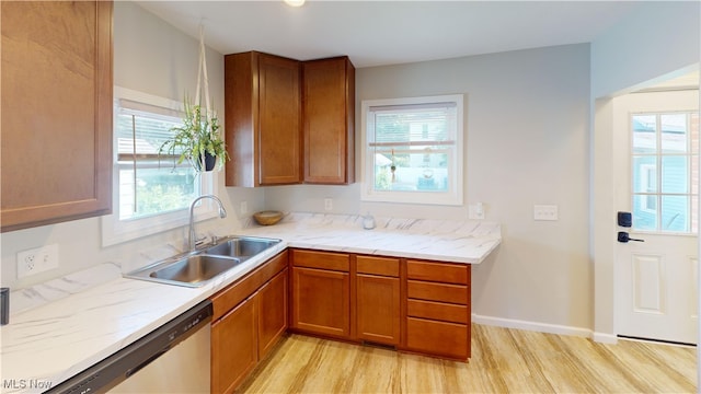 409 W Grant St, Kent, OH 44240 - kitchen with dishwasher, light wood-type flooring, and brown cabinetry