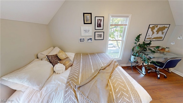 409 W Grant St, Kent, OH 44240 - bedroom featuring wood finished floors and vaulted ceiling