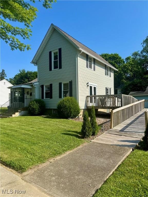 409 W Grant St, Kent, OH 44240 - rear view of house with a lawn