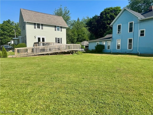 409 W Grant St, Kent, OH 44240 - back of property with a yard and a wooden deck