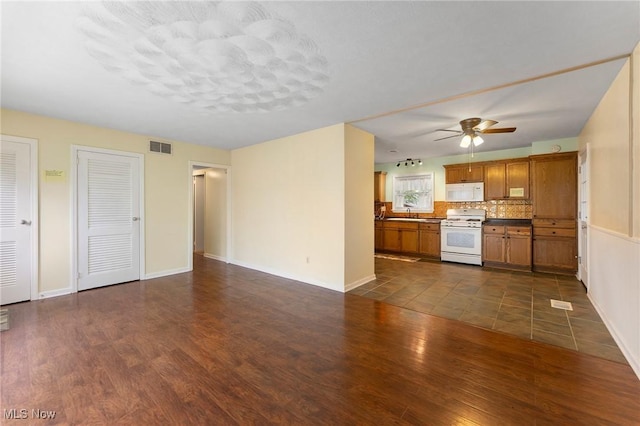 293 W 14th St, Salem, OH 44460 - unfurnished living room featuring dark wood-style floors and ceiling fan