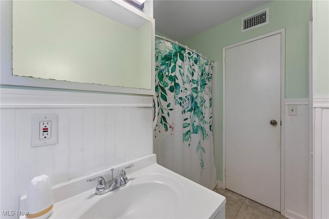 293 W 14th St, Salem, OH 44460 - bathroom featuring vanity, tile patterned floors, and a decorative wall
