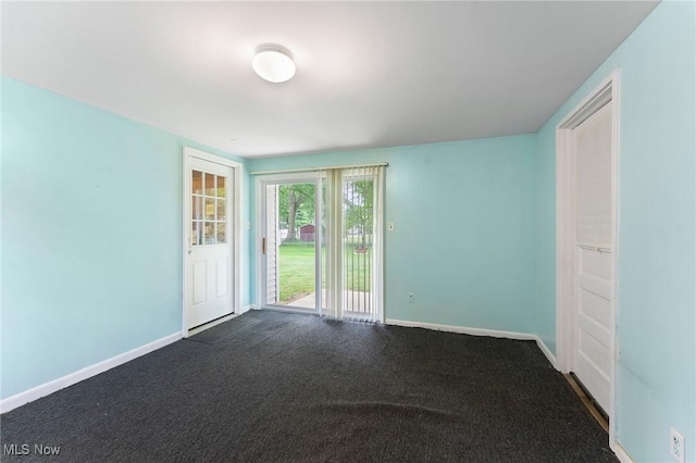 293 W 14th St, Salem, OH 44460 - empty room featuring baseboards and dark colored carpet