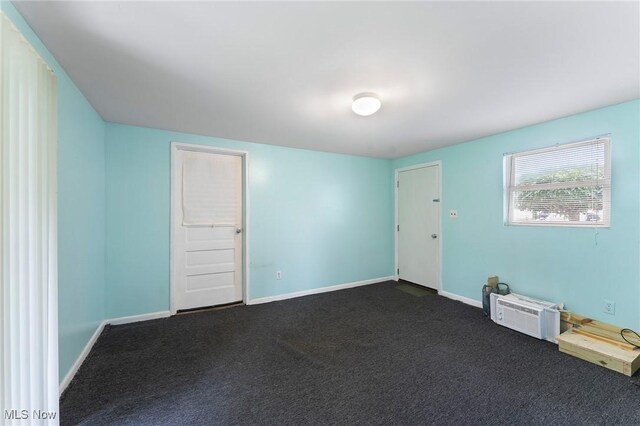 293 W 14th St, Salem, OH 44460 - unfurnished room with dark colored carpet and baseboards