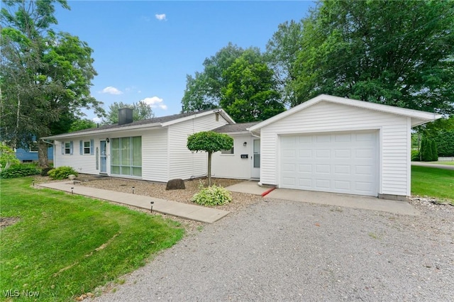 293 W 14th St, Salem, OH 44460 - ranch-style house featuring driveway, a front yard, and an attached garage