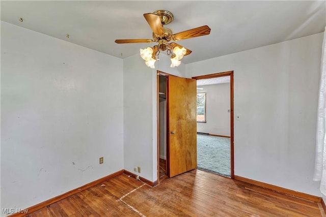 321 Overlook Rd, Vermilion, OH 44089 - empty room with wood finished floors and a ceiling fan
