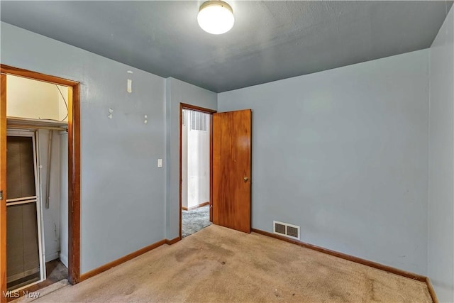 321 Overlook Rd, Vermilion, OH 44089 - unfurnished bedroom with carpet floors and baseboards