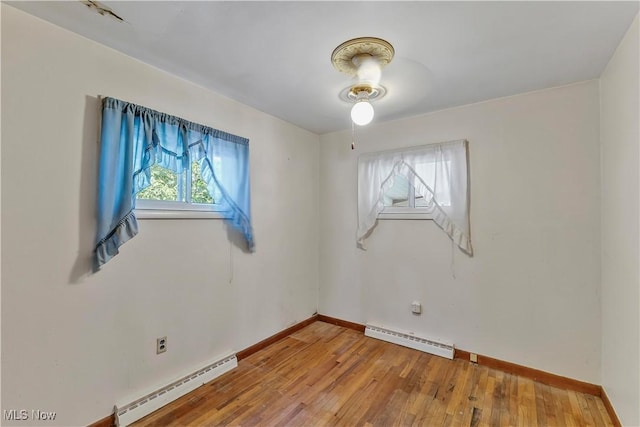 321 Overlook Rd, Vermilion, OH 44089 - unfurnished room with baseboard heating and wood-type flooring