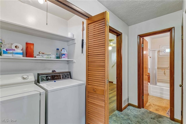 321 Overlook Rd, Vermilion, OH 44089 - washroom with carpet, washer and clothes dryer, and a textured ceiling