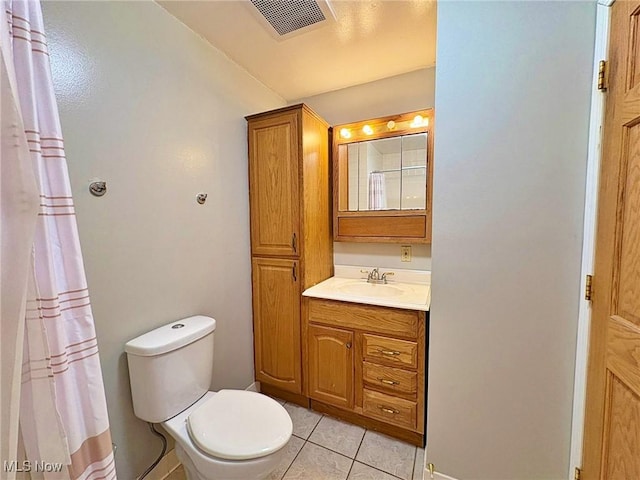 10511 Darrow Rd, Vermilion, OH 44089 - full bathroom featuring vanity, tile patterned flooring, and a shower with shower curtain
