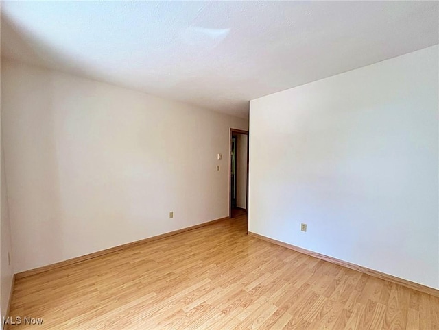 10511 Darrow Rd, Vermilion, OH 44089 - empty room featuring light wood-style flooring