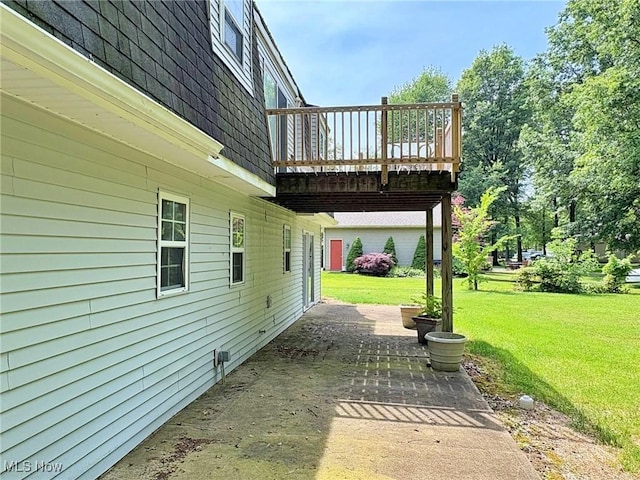 10511 Darrow Rd, Vermilion, OH 44089 - view of green lawn with a wooden deck and a patio