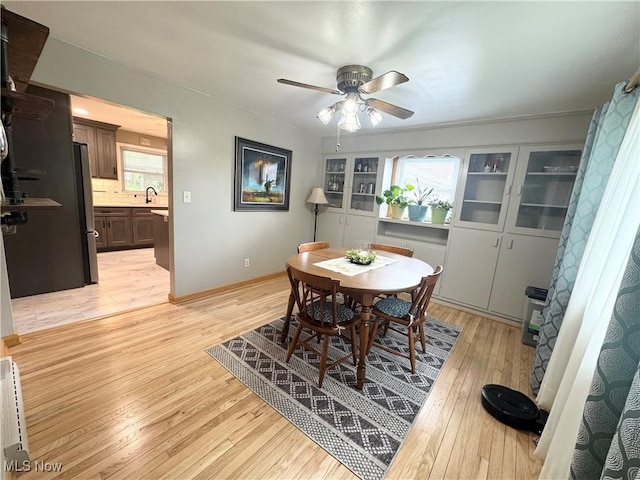 470 Geneva Ave, Struthers, OH 44471 - dining room featuring light wood-style flooring and ceiling fan