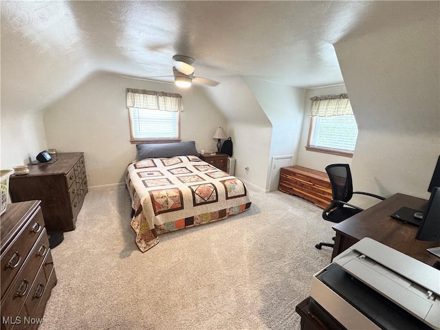 470 Geneva Ave, Struthers, OH 44471 - bedroom featuring multiple windows, light carpet, lofted ceiling, a desk, and a ceiling fan